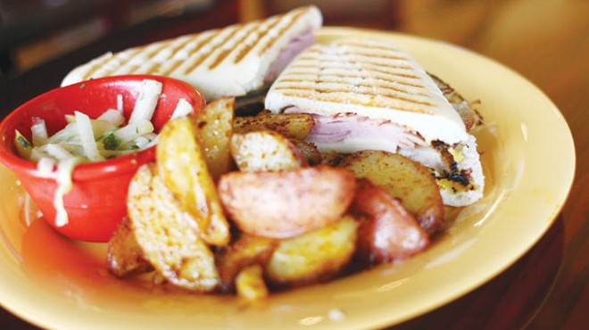 A Cuban panini with baked potato wedges from Calypso.
