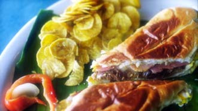 A Cuban sandwich at La Marginal, flanked by plantain chips.