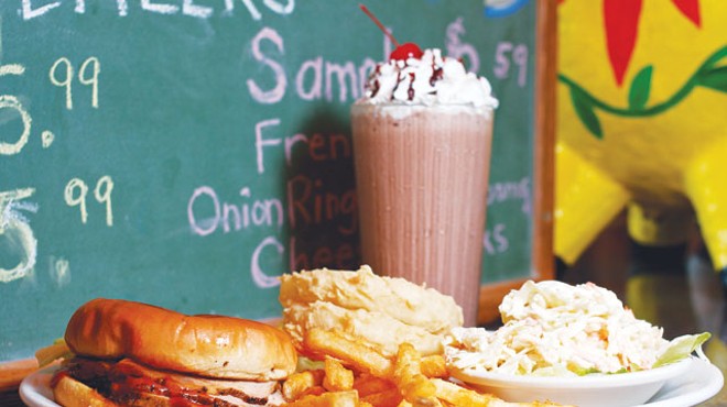 Pig sandwich, fries, onion rings, cole slaw and a chocolate shake from the Pig Stand.