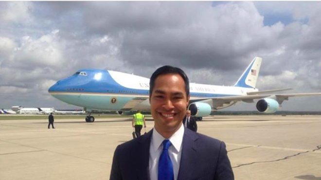 Julián Castro mugs in front of the plane he'd like to ride in one day.