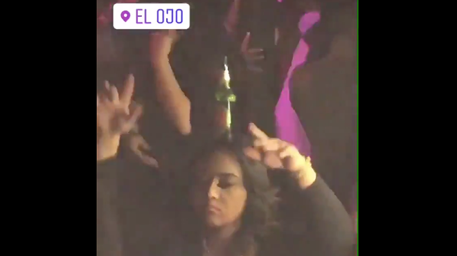 This Girl Dancing with a Beer On Her Head at El Ojo Might Just Be Our Spirit Animal