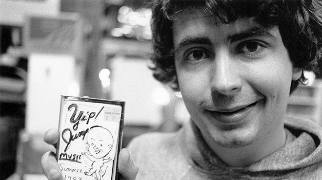 Daniel Johnston shows off one of his self-released tapes.