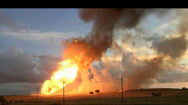 A fire from a natural gas pipeline explosion burns near Cuero.