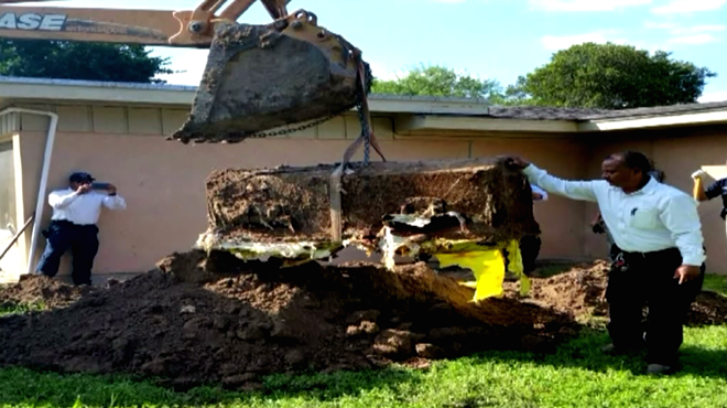 A coffin was found buried in a backyard on Elm St.