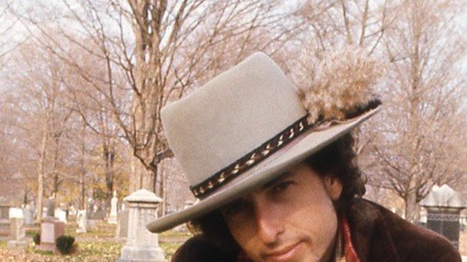 Dylan at the gravesite of Jack Kerouac.