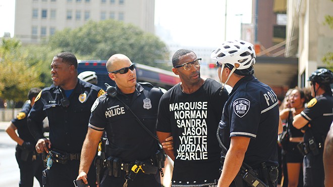 Black Lives Matter organizer Mike Lowe is shown being arrested last summer in the file photo. Mayor Ivy Taylor has invited him to join a task force on police accountability reform. Lowe criticized a collective-bargaining agreement passed by City Council Thursday for not including accountability reform.