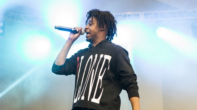 Danny Brown rockin' the mic and his trademark hairdo.