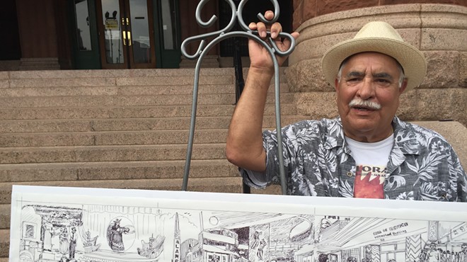 Joe Lopez stands beside his rendering of San Antonio's "the good old times."