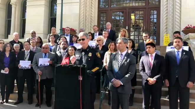 Chief McManus, flanked by San Antonio officials, at Thursday's press conference.