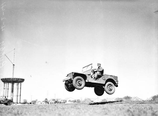 Military police at Fort Sam Houston had some fun. A soldier demonstrated the jeep's ability to jump in this photo from 1941.