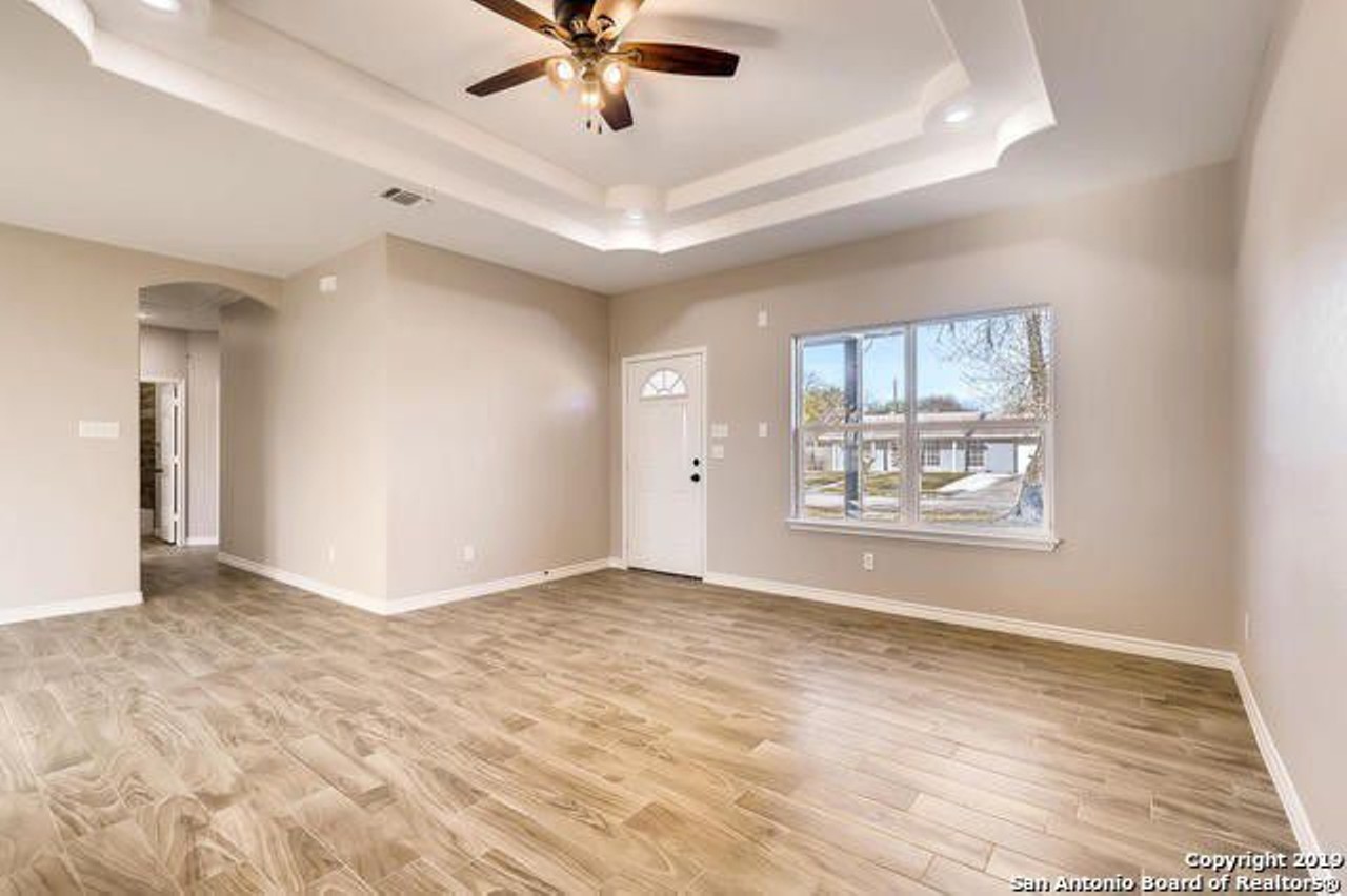 It boasts wood-inspired tile floors (which means that your dog's paws can't scratch it up) and vaulted ceilings.