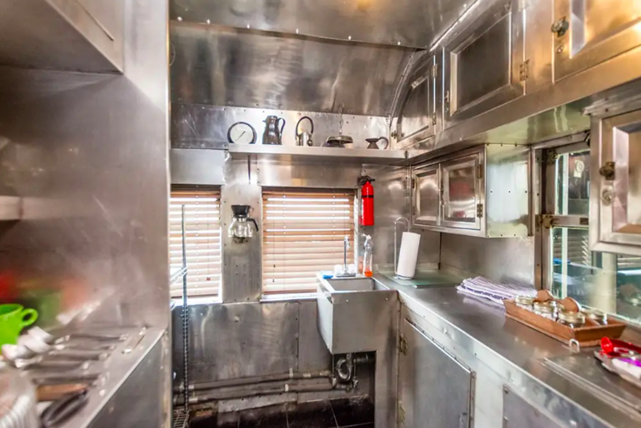 There's also a metal-heavy kitchen with a coffee and tea bar, small fridge and microwave.