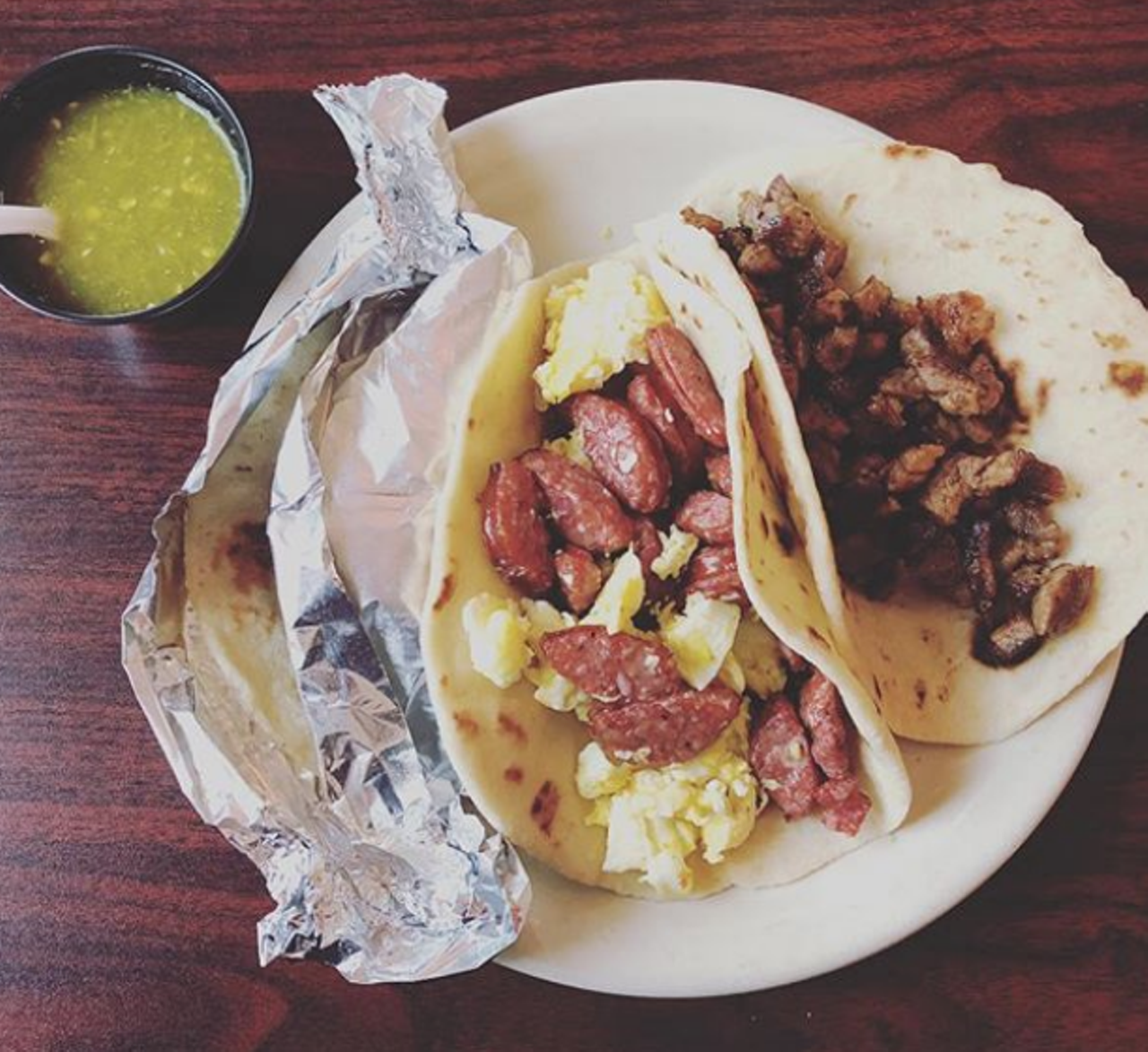Breakfast tacos
While we won’t fight anyone to “claim” breakfast tacos anymore, it’s undeniable that breakfast tacos are crucial to San Antonio’s food landscape and culture in general. With so many taquerias/Mexican restaurants as well as fillings to try out (unless you’re dedicated to your favorites), eating a breakfast taco is never the same experience. So go ahead and eat all the breakfast tacos you desire, in the name of San Antonio.
Photo via Instagram / eatmigos