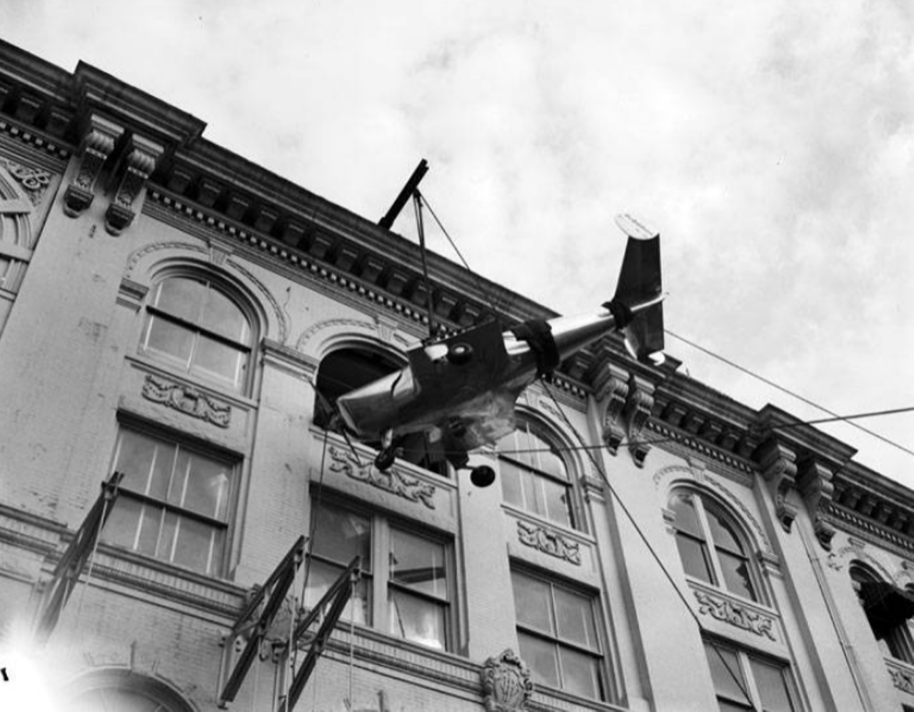 A crew hoisted this airplane up through a window, as it was part of a promotional season around Christmas.