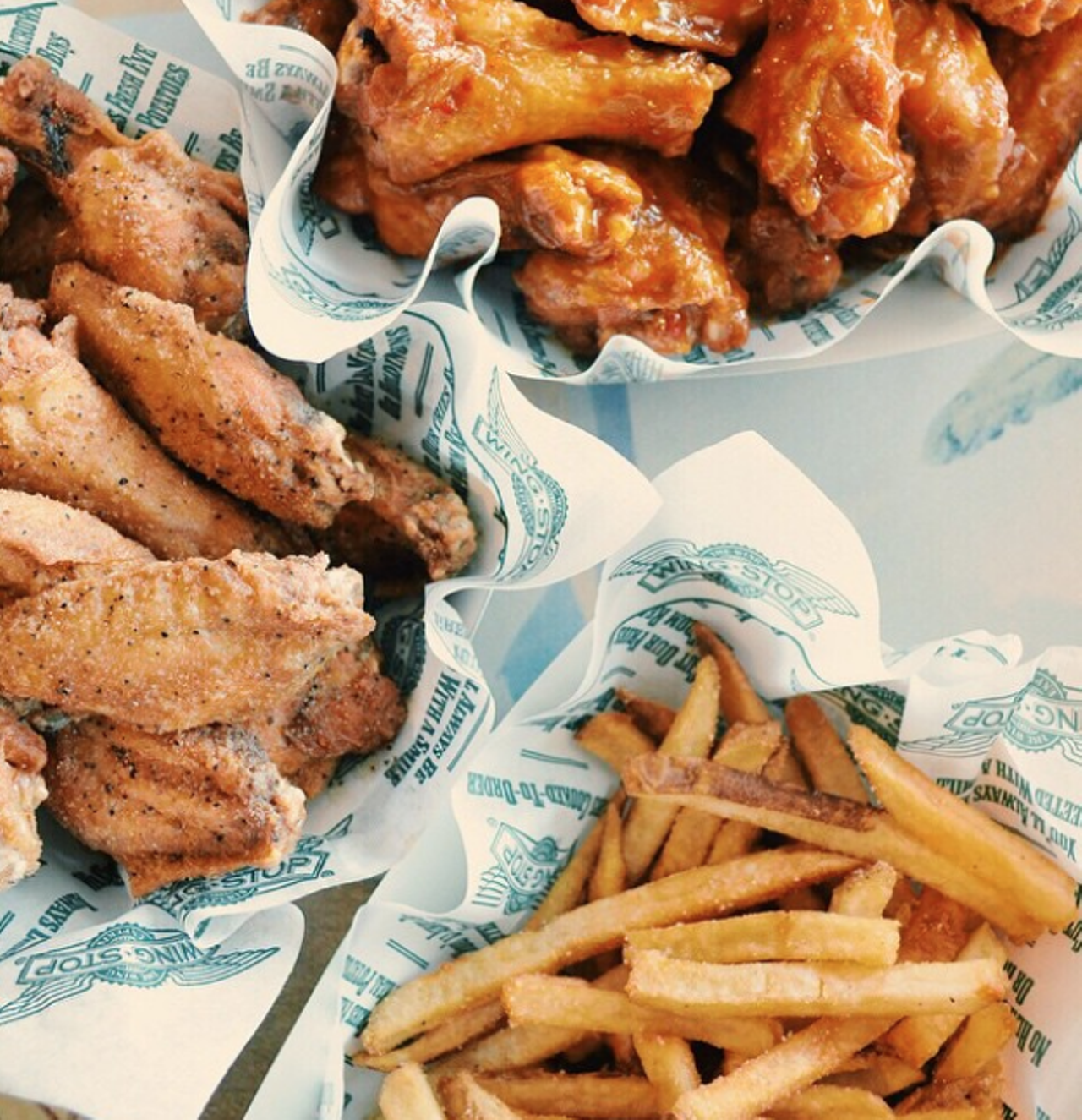 Wingstop
Multiple locations, wingstop.com
With an aviation theme to offer minimal decor, Wingstop offers flavorful wings, available classic style or boneless. The Dallas-based chain has also expanded its menu recently, adding flavored fries, seasonal flavors and new sides like Cajun Fried Corn. And those fries? They’re the cherry on top, most definitely.
Photo via Instagram / wingstop