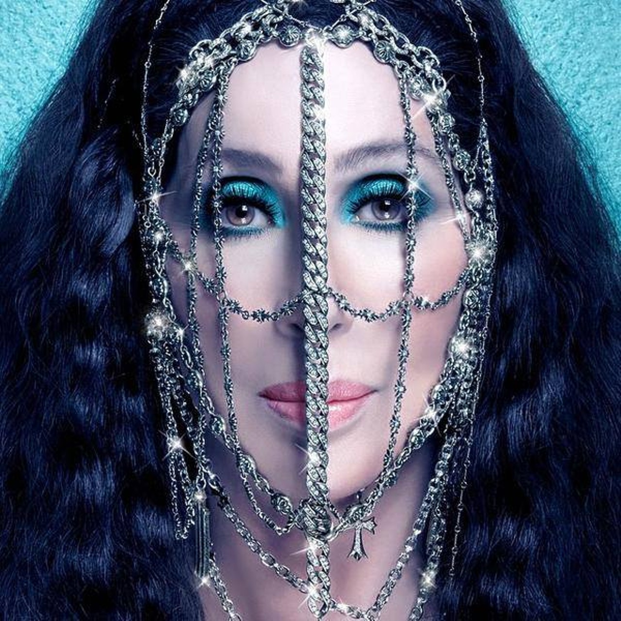 The sparkle. The drama. Only Cher can pull off a chain mask. 
Photo via Facebook / Cher