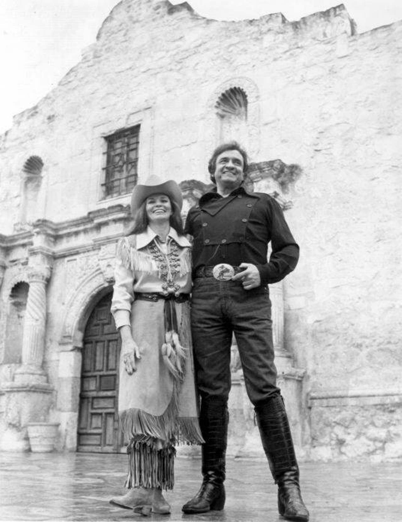 April 9, 1982 , Johnny Cash and  June Carter Cash pose in front of the the Alamo.