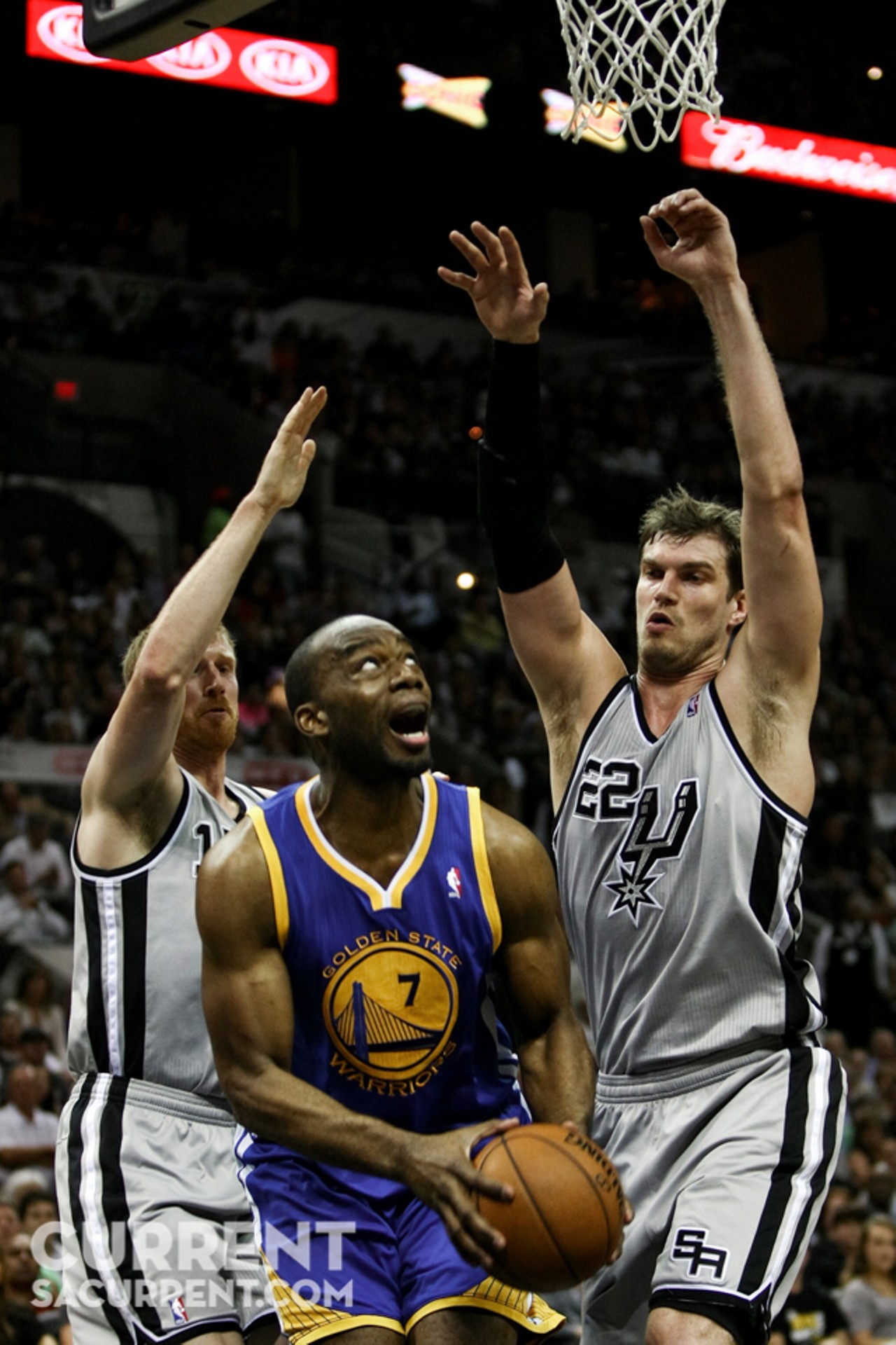 Golden State's Carl Landry gets caught under the basket by San Antonio's Matt Bonner(left) and Tiago Splitter (right) during the 1st half of Game 5 of the Western Conference Semi-Final Playoff series on Tuesday May 14th, 2013 in San Antonio, Texas (Josh Huskin / www.joshhuskin.com)