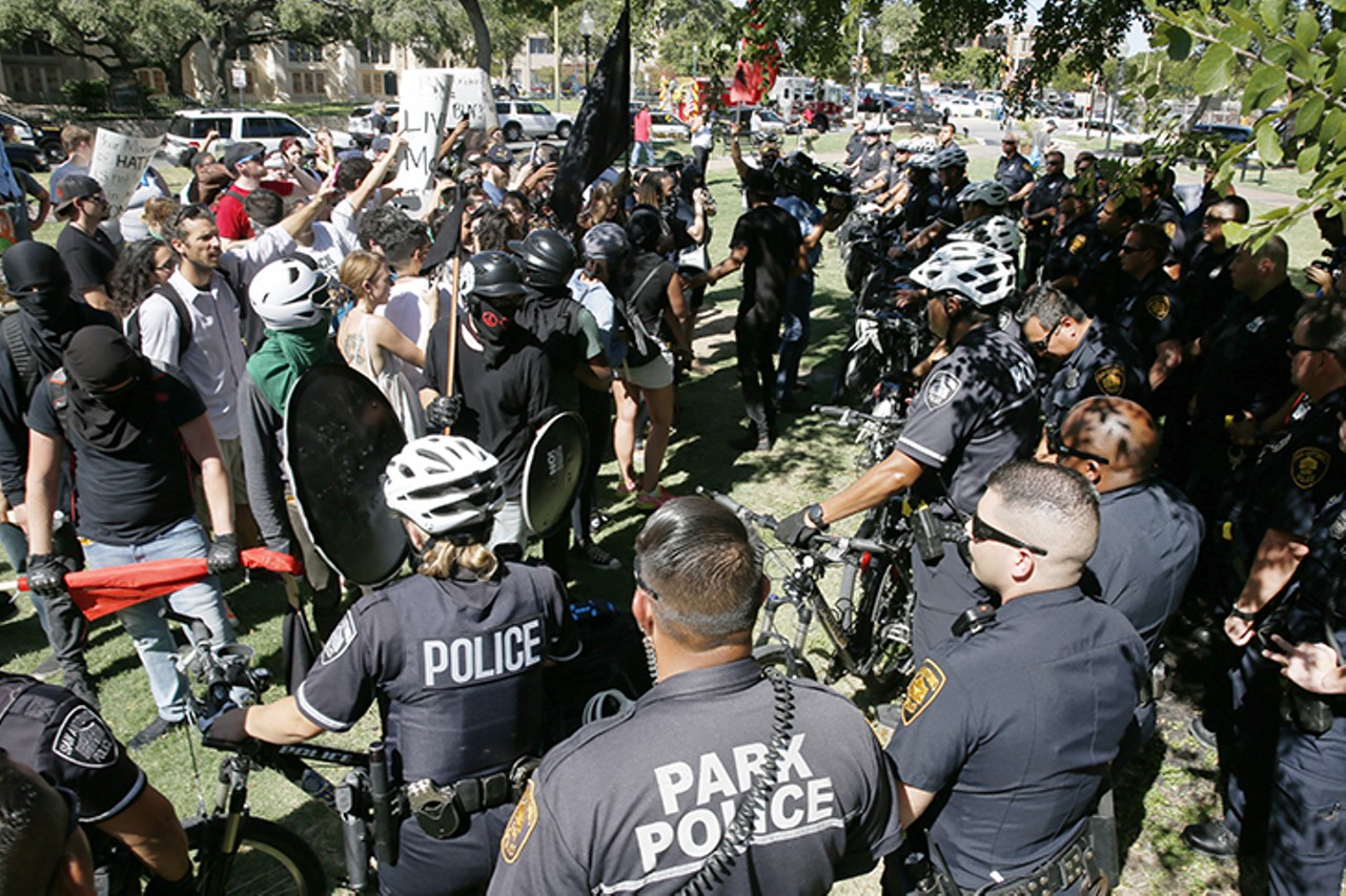 Protestors armed and ready for confrontation met Saturday, Aug. 12, 2017, at Travis Park in San Antonio. The protests began in response to talks of taking the confederate statue, which stands in the center of the park, be taken down in city council. Counterprotestors matched the nationalists with microphones and bandanas to conceal identity.