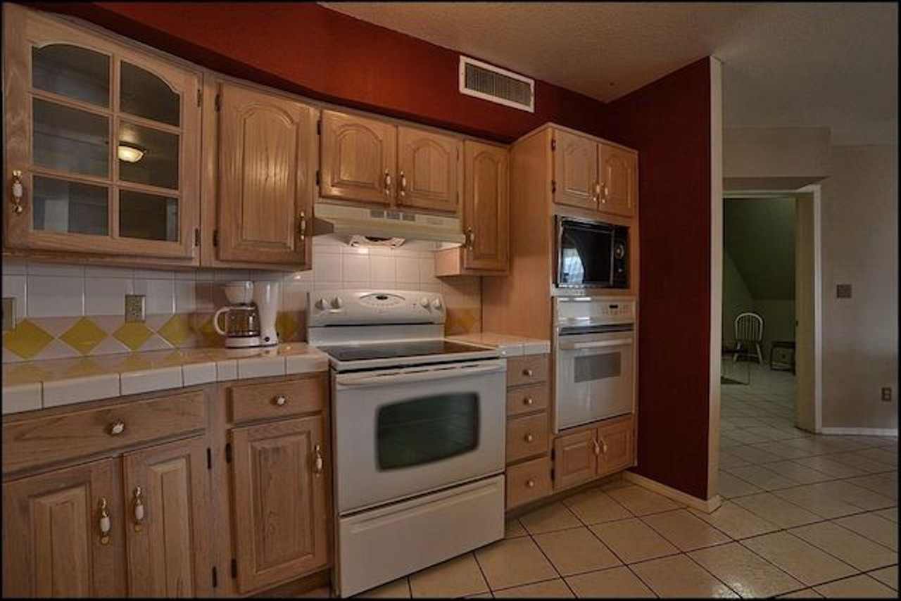 This kitchen features a built-in electric oven and freestanding electric range, so be prepared to cook a turkey or two here.
