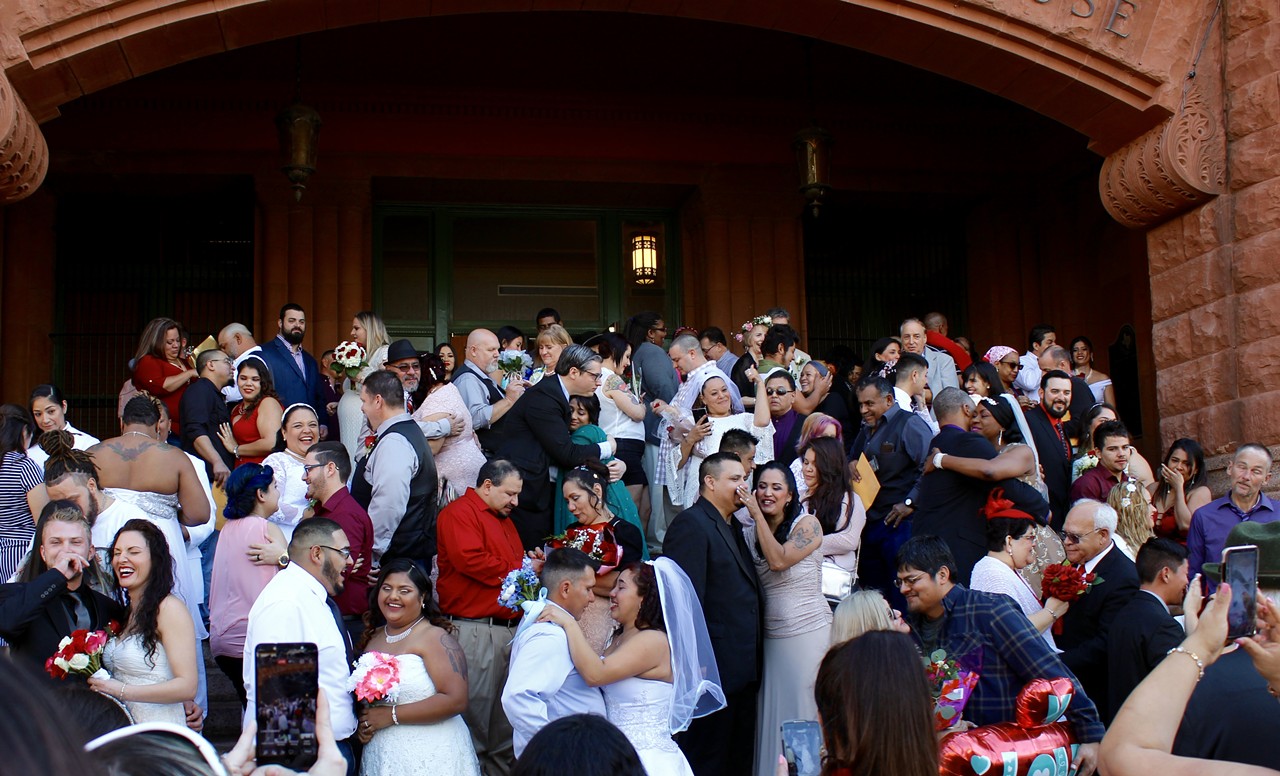 The crowd of couples after being pronounced legally wed.