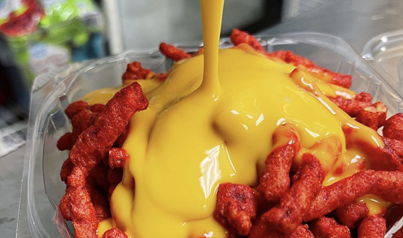 Hot Cheetos with Cheese
Any local can testify that they grew up on this iconic duo. Not only do ice cream trucks and snack shops sell the puro snack, it has also inspired restaurants to incorporate the duo into their menus, using Hot Cheetos on everything from burgers to pizza.
Photo via Instagram / chamoycitylimits