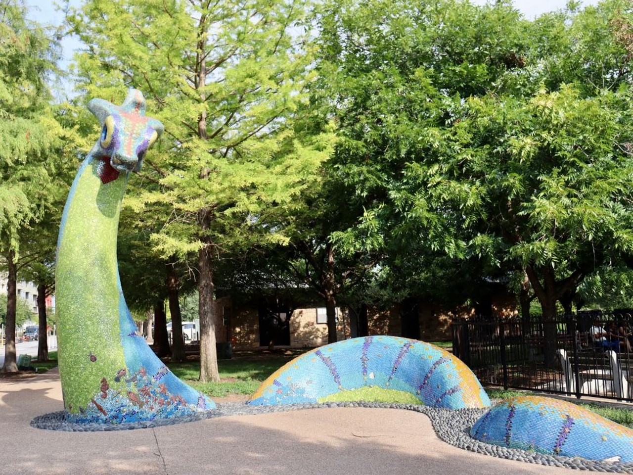 Lake Nessy
4550 Mueller Blvd., Austin
This 16'x30' multicolored sea serpent sits in Austin's Mueller Lake Park across from the Thinkery. The glass and ceramic mosaic monster was created by artist Dixie Friend Gay in collaboration with Blue Genie.