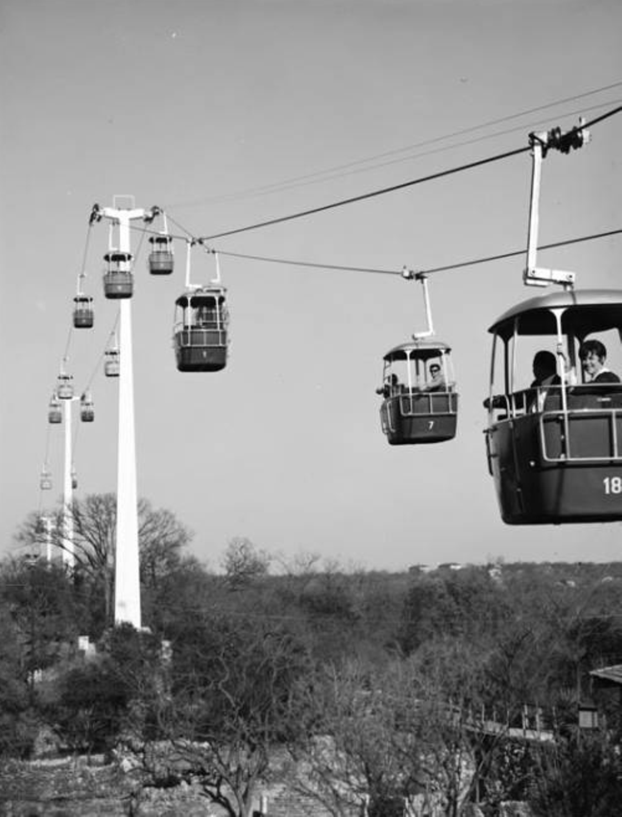 The Sky Ride at Brackenridge Park
For 35 years, the Sky Ride offered San Antonians and tourists amazing views of the city skyline and a magical view of Brackenridge Park below. However, over time, the colorful four-foot wide gondolas deteriorated, and in 1999, city council opted not to spend the millions of dollars required on upgrades. For those old enough to remember, a visit to Brackenridge or the nearby San Antonio Zoo was never quite the same after the ride's closure.
Photo via UTSA Libraries Digital Collections