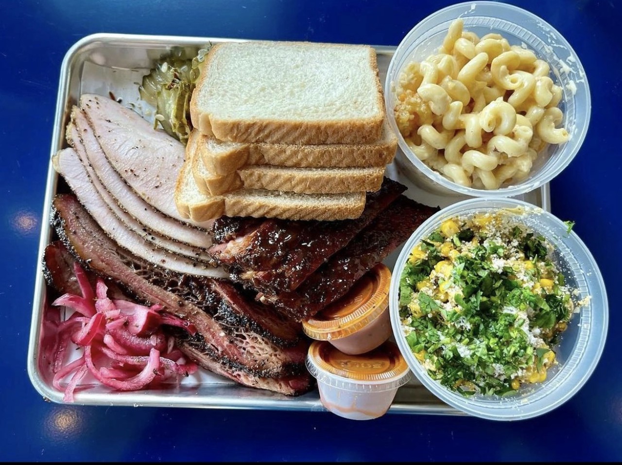 Blu Lacy
1303 Lorenzo St., Castroville, (830) 359-8720, instagram.com/blulacysmokehouse
Brought to us by Esaul Ramos — the brains behind 2M Smokehouse — Blu Lacy made its debut in Castroville this fall. The spot smokes its meats on site in a new pit building that houses a mammoth wood-fired smoker from Texas-based M&M BBQ Company. Blu Lacy also features desserts and bread made by Ramos’ wife Grecia, who recently opened her own venture, Baked, next door.