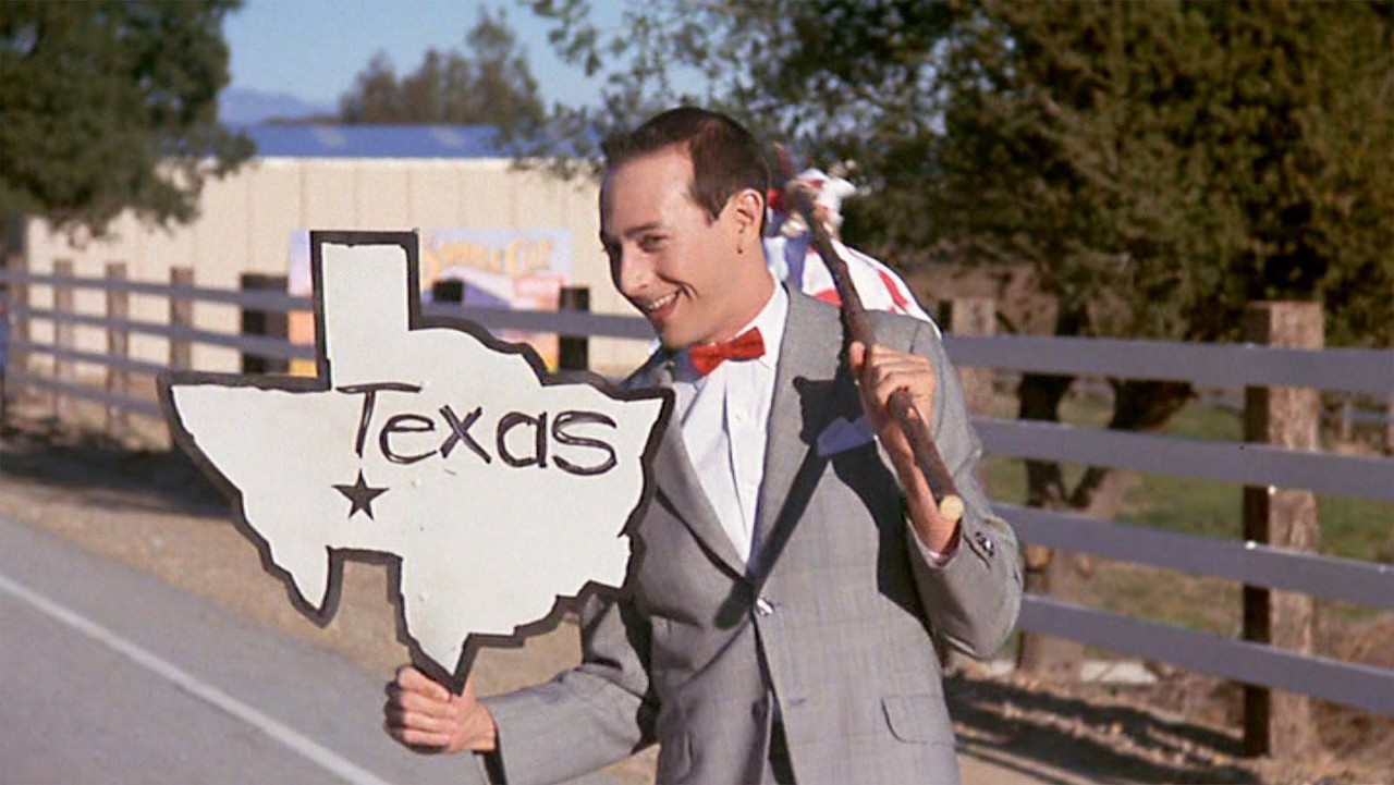 Paul Reubens – Pee-wee’s Big Adventure 
He only spent an afternoon in San Antonio to shoot two short scenes, but Reuben’s Pee-wee had to search in the basement of the Alamo to find his stolen bike. 
Photo via Warner Bros.