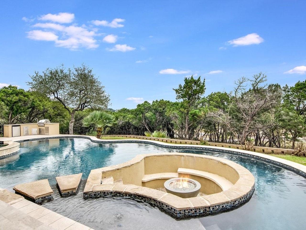 6118 Sierra Avila
$1,959,900
Fire by the pool? 
A backyard firepit is great, but this house takes it to the next level — by putting it inside the pool.