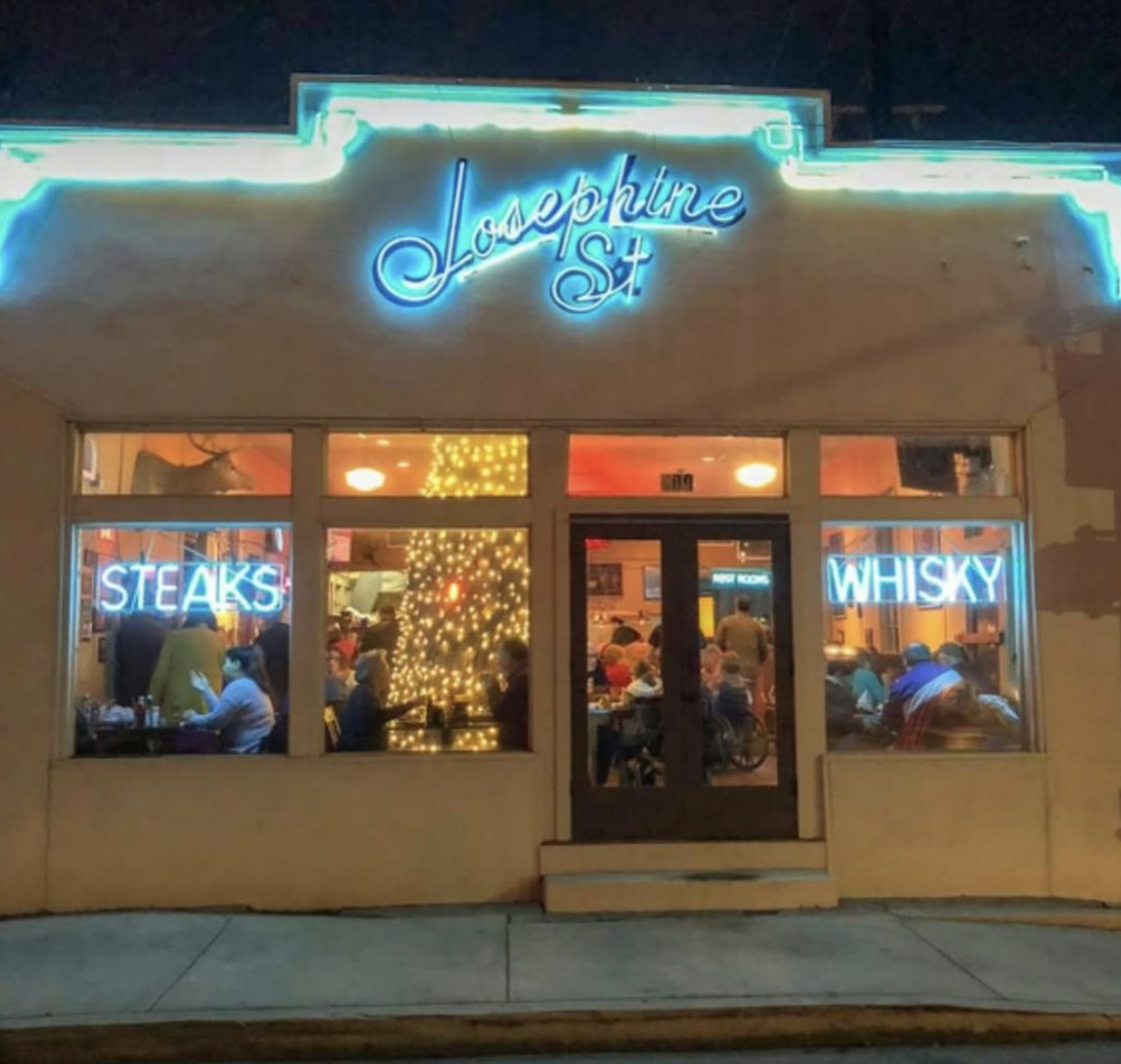 Josephine Street Cafe, 1979
400 E Josephine St, (210) 224-6169, josephinestreet.com
The neon in the window says “Steaks & Whisky,” and we’re wondering what more you could want in a cozy spot? The funky, historic building dates back to the early 1900s, and even features a 500-year-old tree right in the middle of the dining room. 
Photo via Instagram / josephine_street