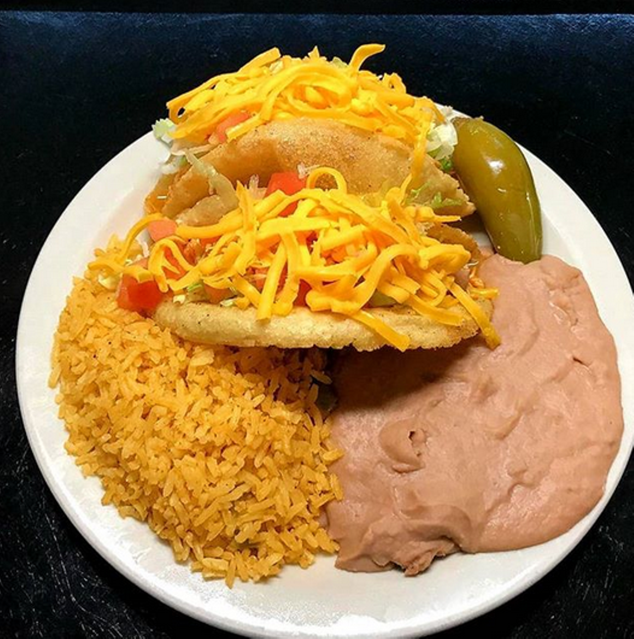 Ray's Puffy Tacos
822 SW 19th St., raysdriveinn.net
Order delivery or pickup from Ray's Drive Inn, who boasts the creation of the puffy taco. We’re not going to get in the middle of the puffy taco debate, but we will say that the drive-in model is super convenient for social distancing. 
Photo via Instagram /  
raysdriveinn
