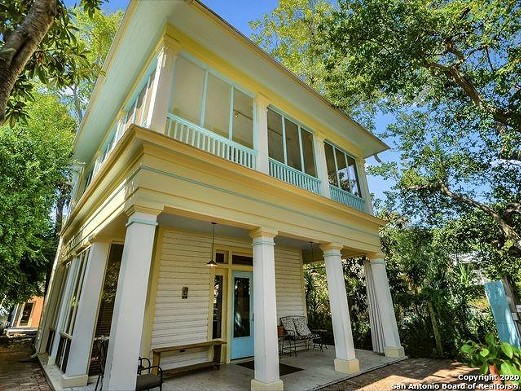 A 110-year-old home for sale in San Antonio has an amazing balcony and a backyard studio
