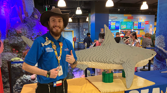 Kevin Hintz, who built the lego shark, stands with his creation inside Legoland Discovery Center San Antonio.