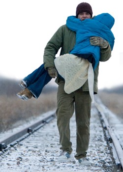 A presumably lucid Nick Stahl carries AnnaSophia Robb (again, presumably) down the long and ... undwinding railroad.