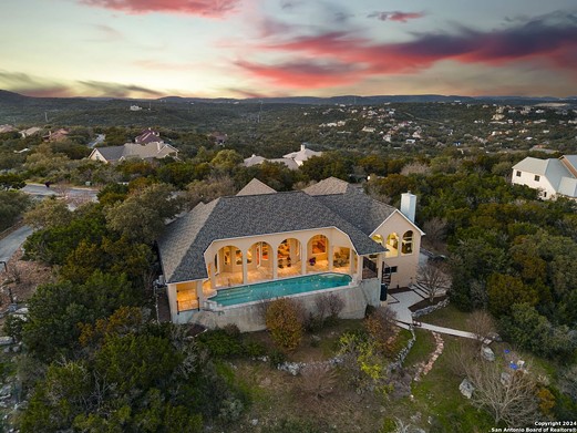 A San Antonio home for sale has windows offering panoramic Hill Country views