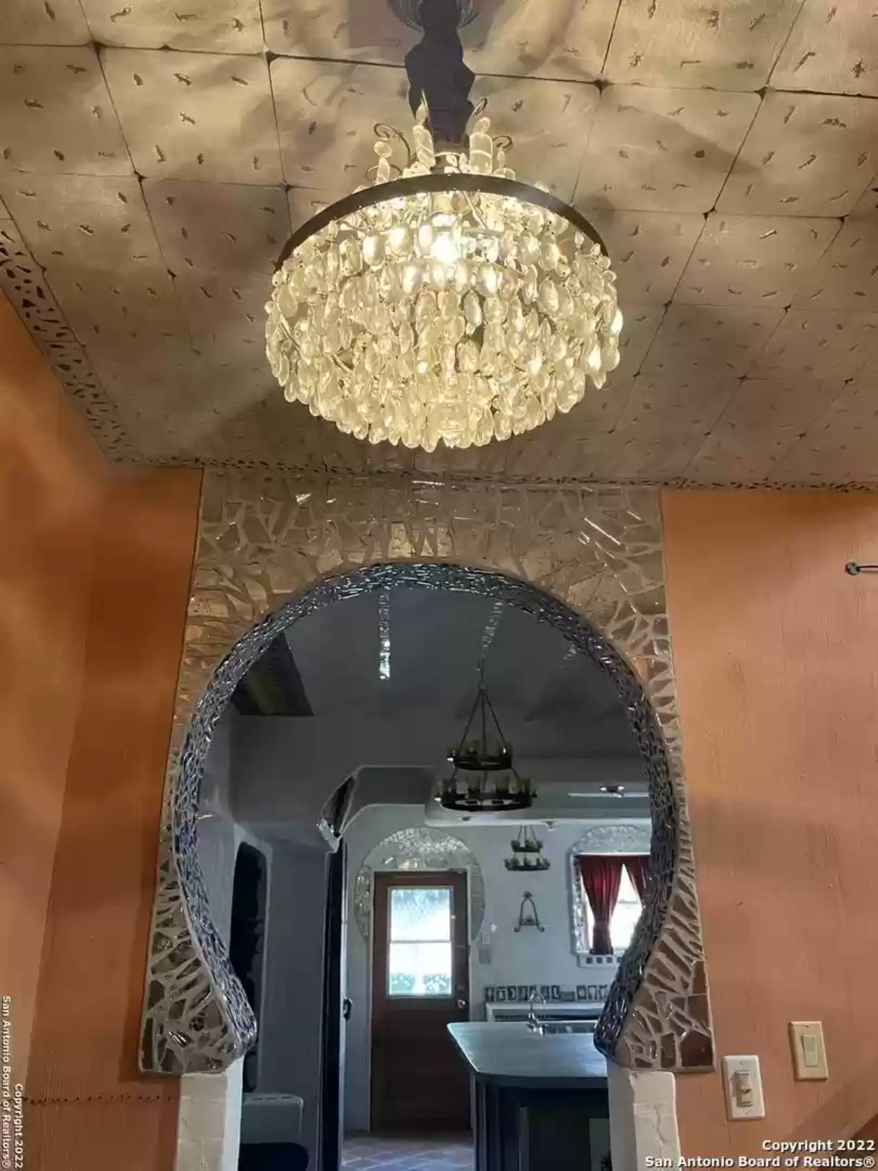 A San Antonio home with mosaic ceilings and a bar that looks like a piano is back on the market