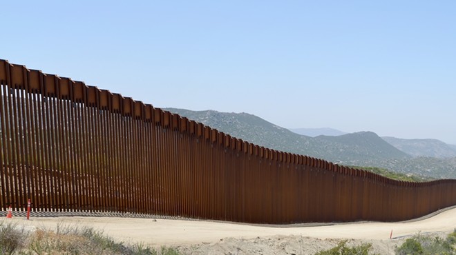 A stretch of wall closes off passage between Mexico and the United States.
