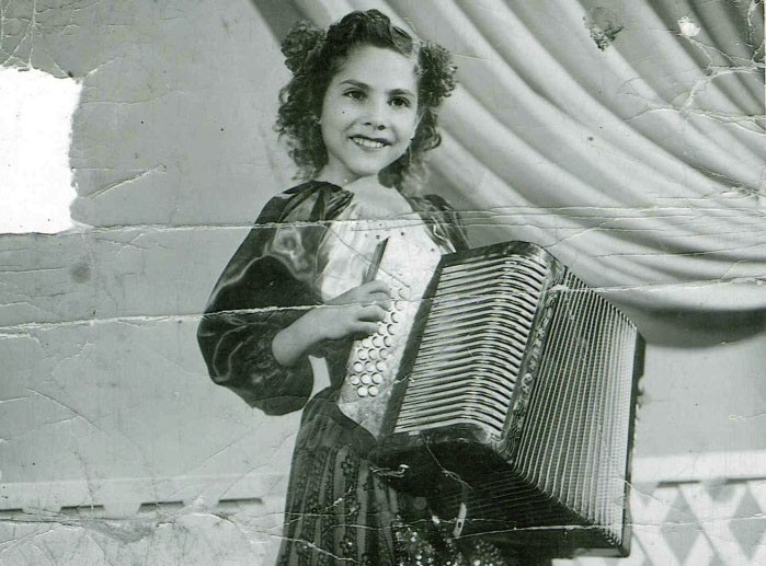 Accordion queen Eva Ybarra as a child. - COURTESY
