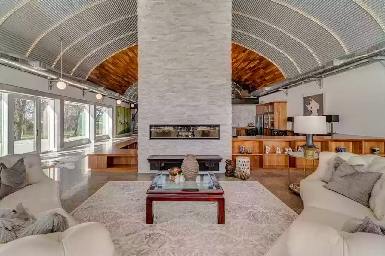 An east Texas House for sale looks like an airplane hangar with a wraparound swimming pool