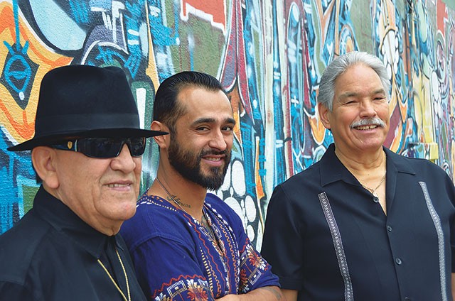 Arturo "Sauce" González, Sam Villela, and Ernie Garibay at the mural near the old Saluté. - SCOTT ANDREWS