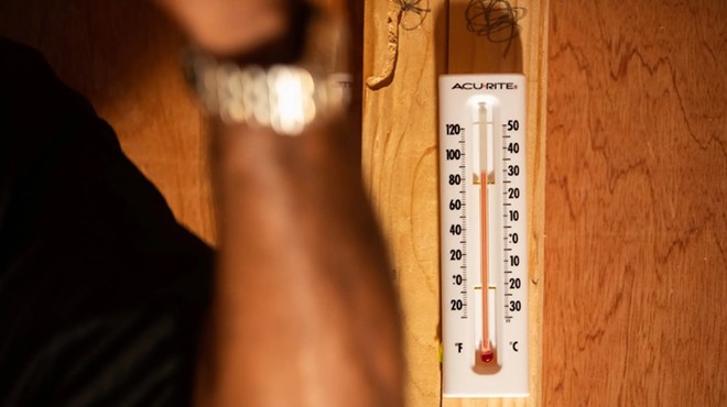 A thermometer is pictured inside a mock prison cell during a “Beat the Heat” awareness event at the Texas Capitol on March 12, 2019.