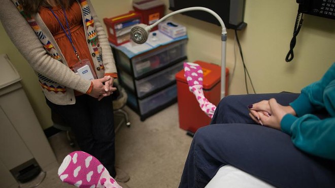 A nurse practitioner consults with a patient at a Planned Parenthood clinic in Austin.