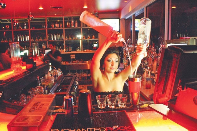 Bartender Nicole Gonzalez demonstrates the long pour at Area 31. - VERONICA LUNA