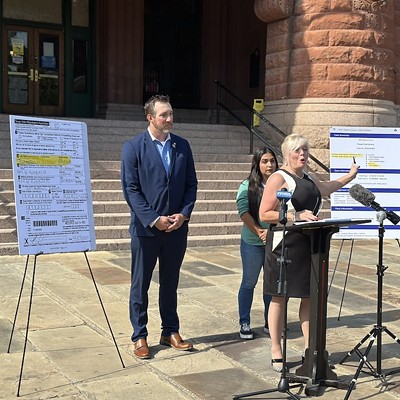 Bexar County Republican Party Chairwoman Kris Coons points to a copy of a document showing that Democrat Kristian Carranza legally changed her last name in 2023.