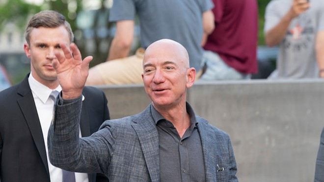 Amazon founder Jeff Bezos waves to reporters in New York City in 2019.