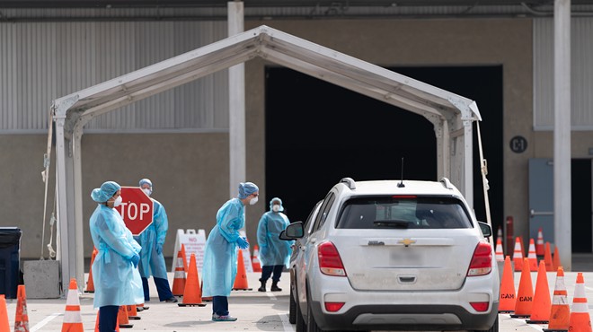 Cars pull up to the city's mobile coronavirus testing site at Freeman Coliseum.