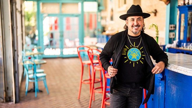 San Antonio chef Rico Torres shows off Family Meal-branded apparel.
