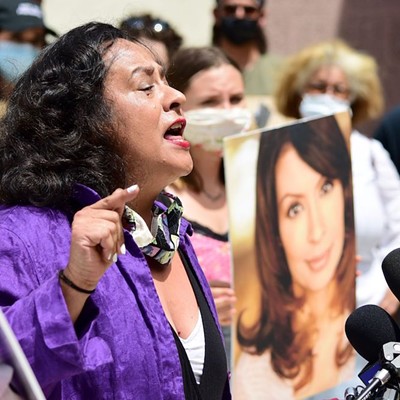 Actress Ingrid Oliu speaks at a press conference demanding justice for her Stand and Deliver co-star Vanessa Marquez.